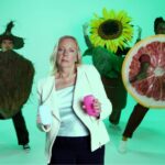 Deborah Meaden stars in a 90s rap-inspired video for Fussy, promoting natural deodorant with catchy lyrics and battling 'aluminium aliens' to banish body odour sustainably.