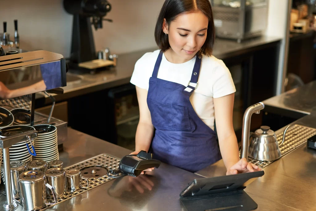 female shopkeeper taking order on a tablet