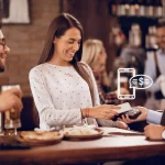 image showing waiter accepting payments digitally using card reader