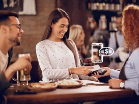 image showing waiter accepting payments digitally using card reader