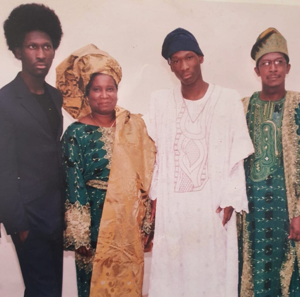 Tj as a kid with his family before moving from nigeria to UK.