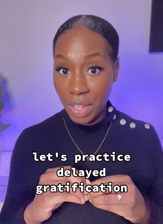 A grab from a video by Ms Bre explaining how to avoid debt.