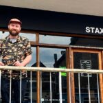 Ex-apprentice of Marco Pierre White, Ben Harrison, opens 'Stax' on Towan Beach, Newquay, combining his passion for food and vinyl music. His creative sandwiches are a hit.