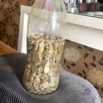 West Yorkshire man saves £5,000 by collecting £1 coins in a Coca-Cola bottle over four years. His TikTok video revealing the total goes viral with 1.6 million views.