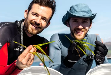 Inventors Sam Rogers and Ed Towler unveil an underwater "lawn mower" to collect seagrass seed pods, helping restore vital marine habitats. Crowdfunding nearly 75% funded.