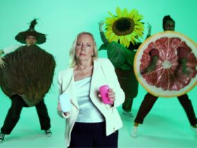 Deborah Meaden stars in a 90s rap-inspired video for Fussy, promoting natural deodorant with catchy lyrics and battling 'aluminium aliens' to banish body odour sustainably.